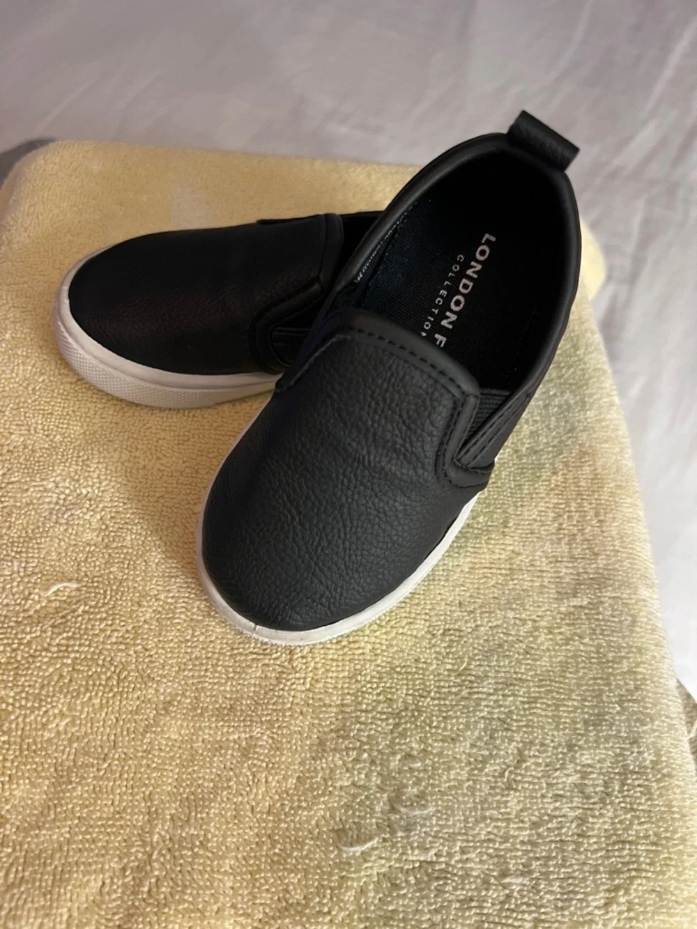 London Fog Kids Black Slip-On Sneakers with White Sole